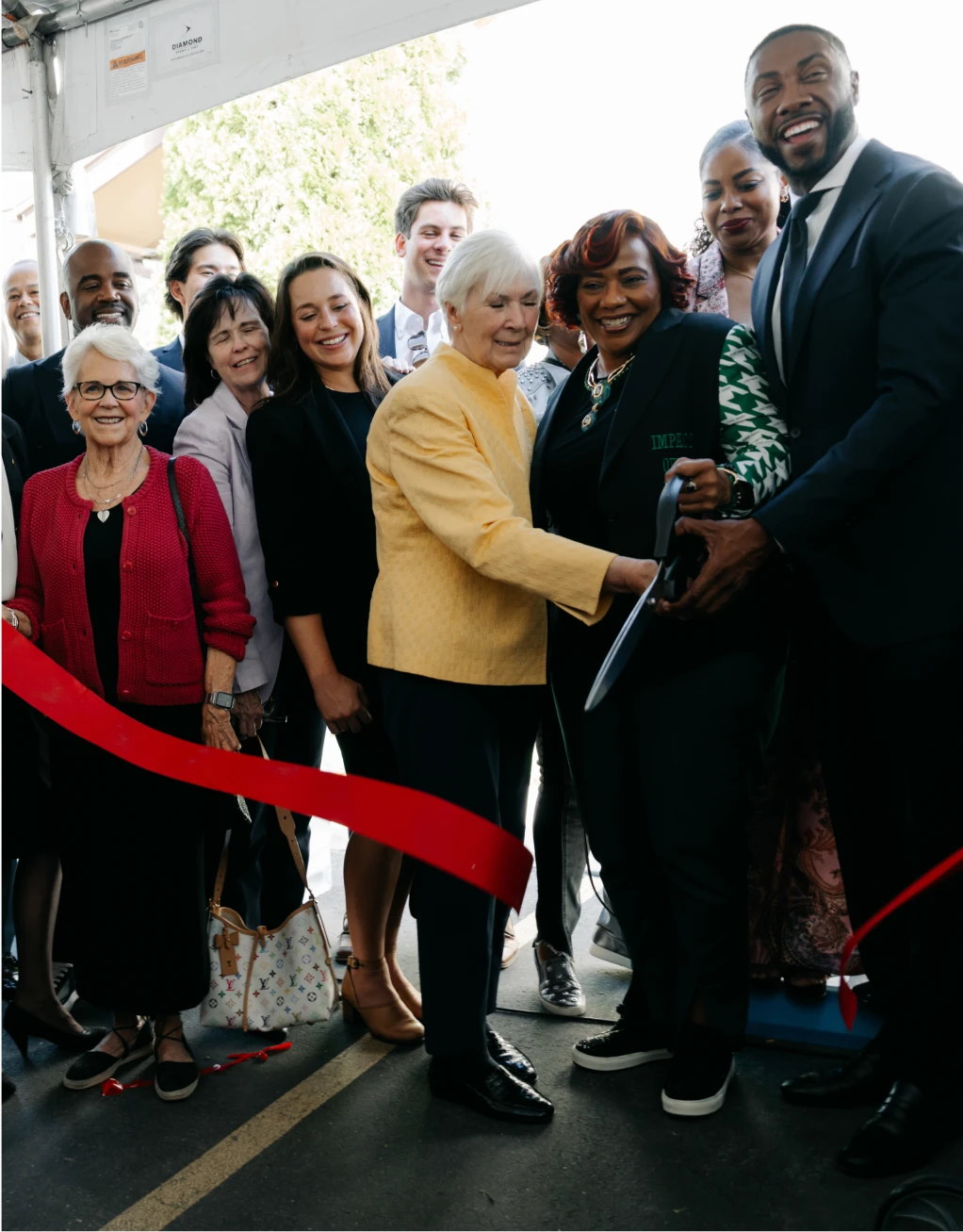 Bankers cutting red ribbon